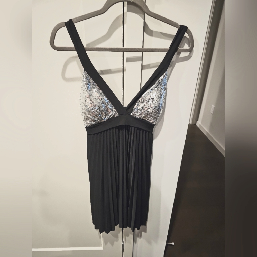 Black dress with silver sequins. Large. Never worn. No tags but like new.